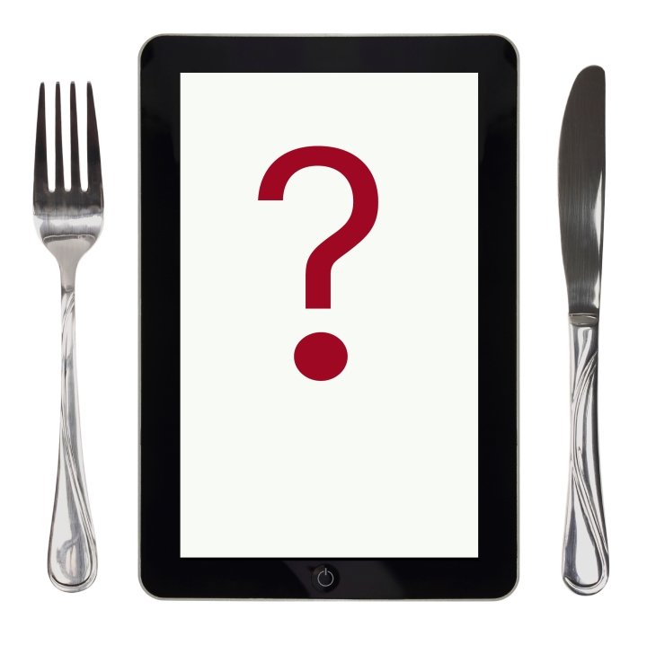Tablet with food photo, fork and knife, conceptual